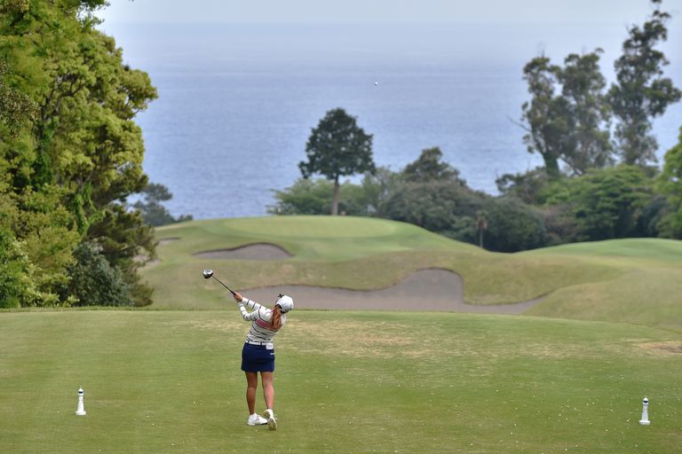 Golf-shot-from-behind-587e42785f9b584db3cda92e.jpg